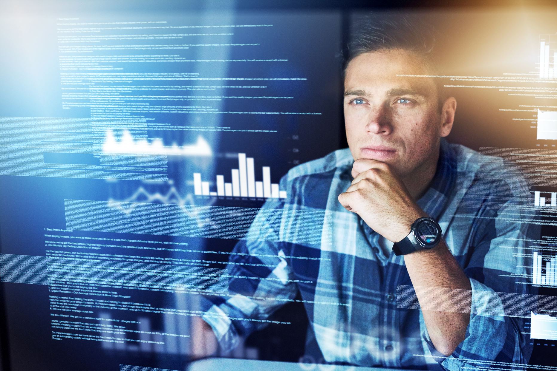 person looking at the screen with graphs on it
